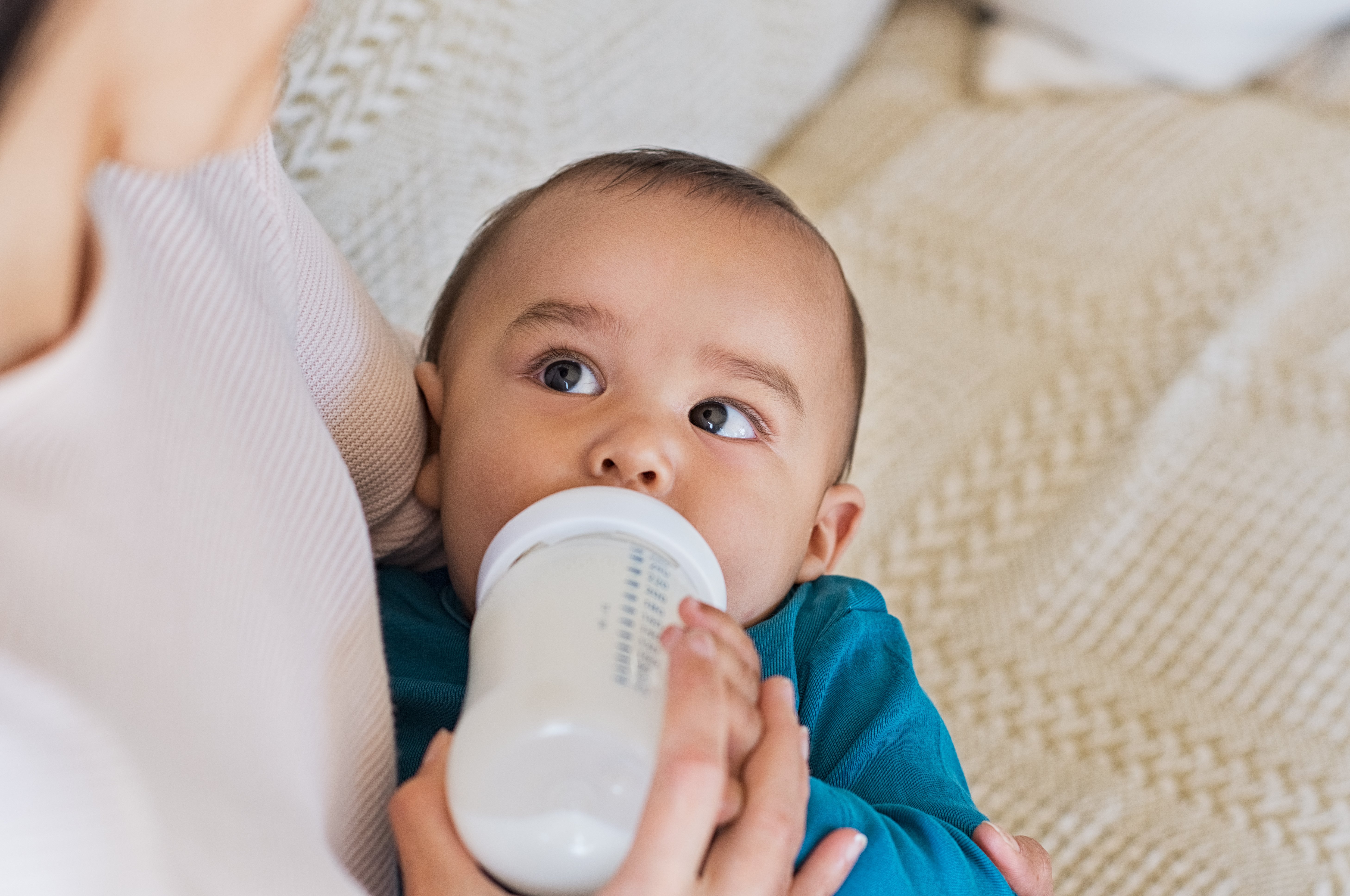 Bottle feeding a shops newborn